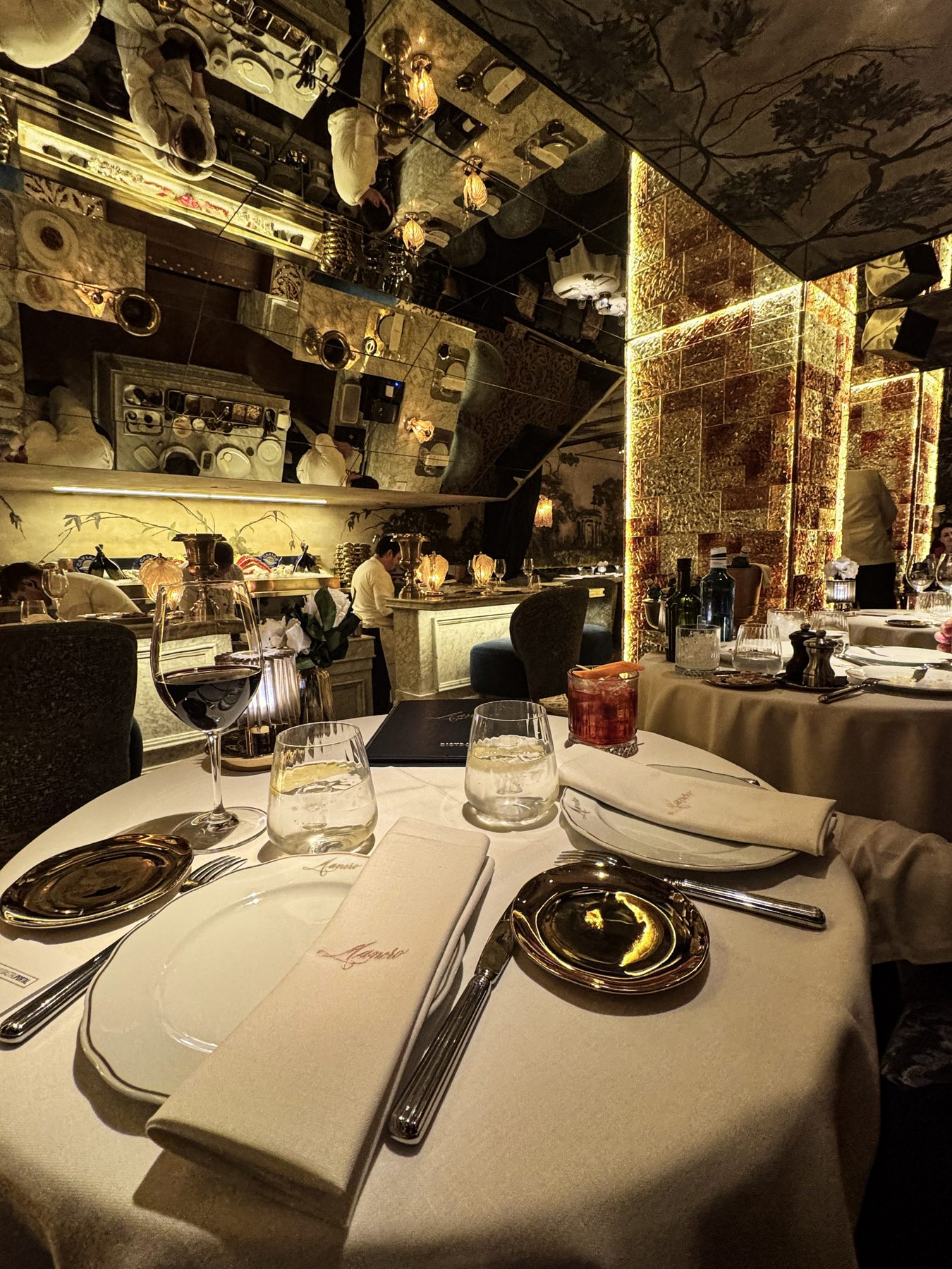 Elegant restaurant table setting with mirrored walls